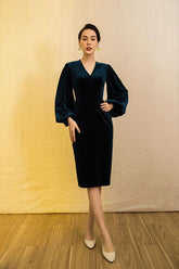 Velvet midi dress with voluminous long sleeves and structured V-neckline for evening wear